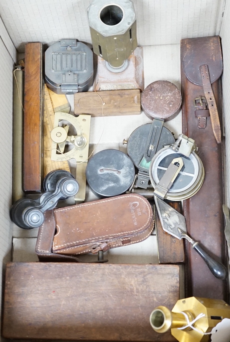 A group of surveying and scientific instruments, early 20th century, including and Elliot brothers London pocket sextant A in the Negretti and Zambra London compass, 80 Cook and Sons York and London level, military issue